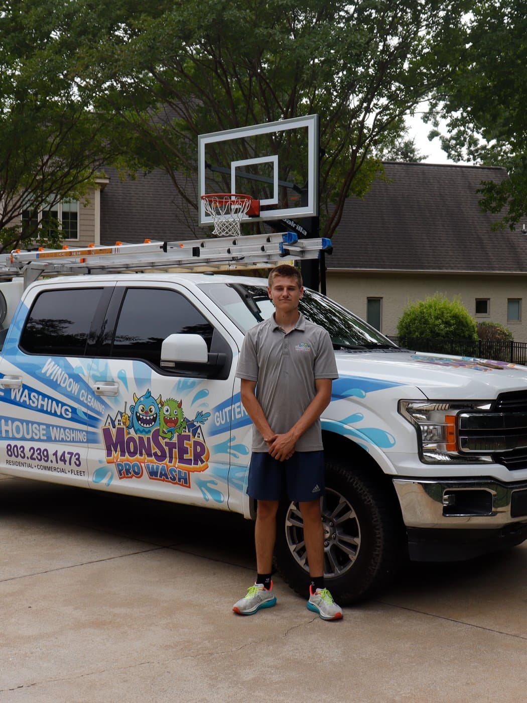 Brayden Rollins, Owner of Monster Pro Wash, in front of his truck